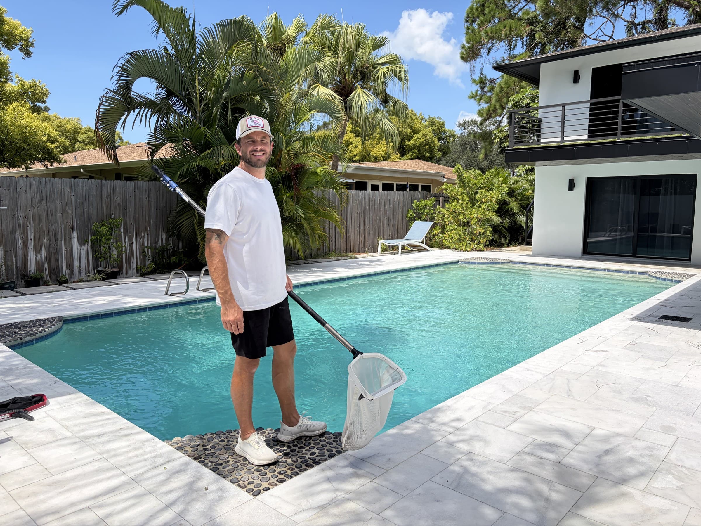 Desmond working beside a swimming pool